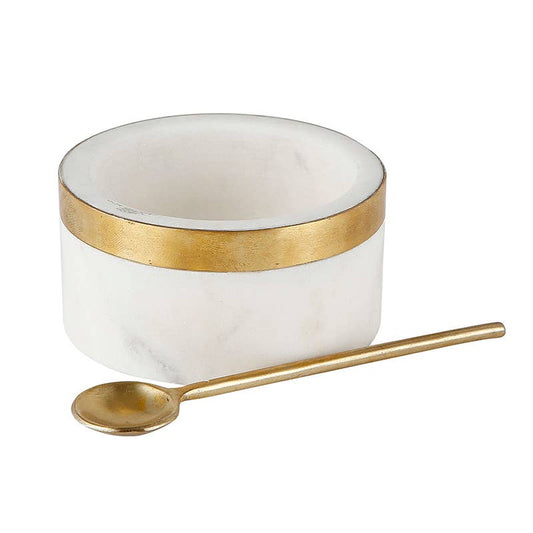 White marble bowl with brass spoon